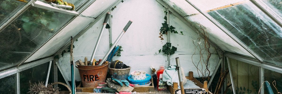 Garden tools arranged on grass